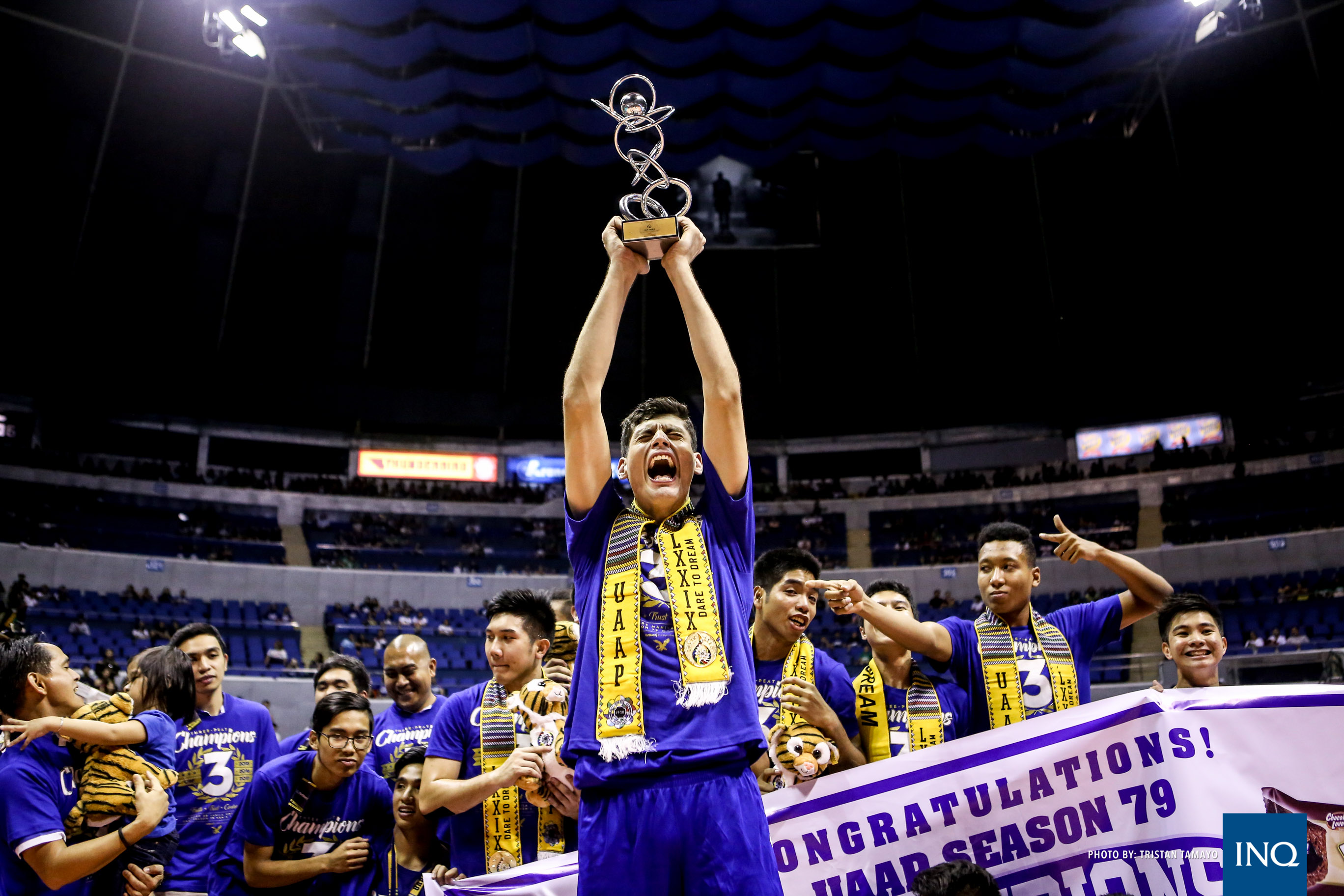 Tony Koyfman lifts his Finals MVP trophy after helping Ateneo beat National University to win the UAAP Season 79 men's volleyball Finals. Tristan Tamayo/INQUIRER.net