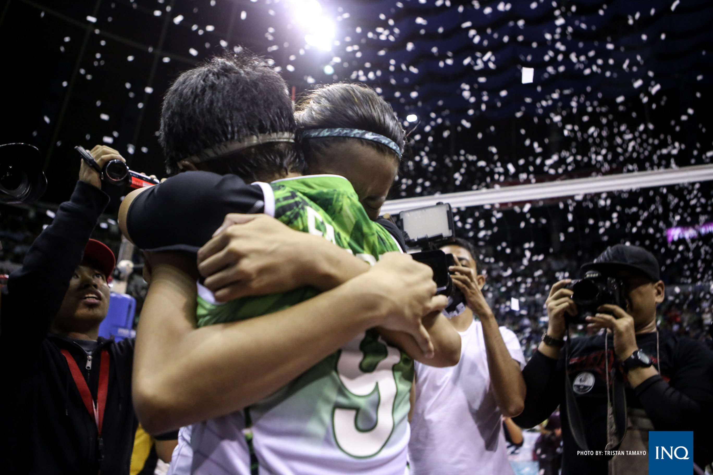 La Salle's Kim Fajardo and Kim Dy share an emotional moment after the Lady Spikers clinched their second straight UAAP title. Tristan Tamayo/INQUIRER.net