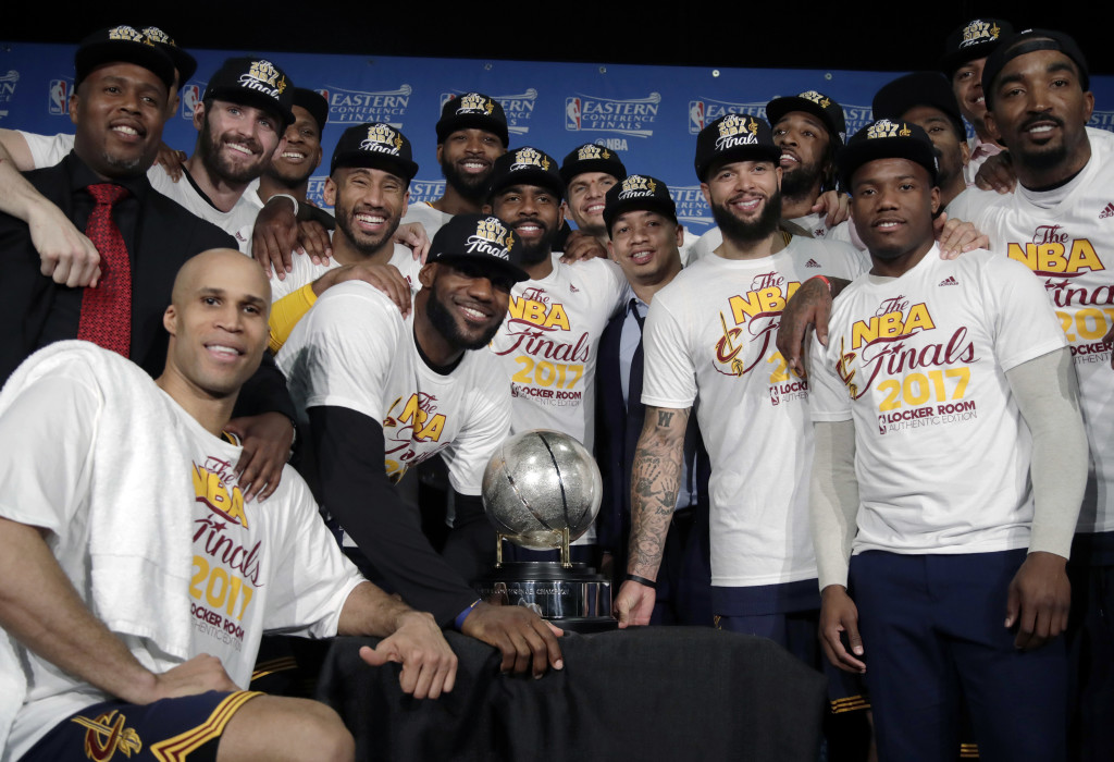The Cleveland Cavaliers pose with their trophy after winning Game 5 of the NBA basketball Eastern Conference finals against the Boston Celtics 135-102, on Thursday, May 25, 2017, in Boston. AP