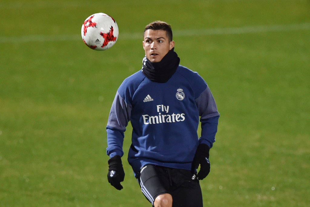 Real Madrid's Portuguese forward Christiano Ronaldo warms up during a training session at Mitsuzawa stadium in Yokohama on December 13, 2016 ahead of their Club World Cup football match against Club America of Mexico on December 15. / AFP PHOTO / KAZUHIRO NOGI