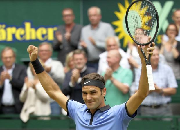 Roger Federer raises arms in victory - Gerry Weber Open - 25 June 2017