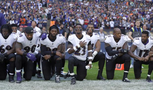 Baltimore Ravens players kneeling - 24 Sept 2017
