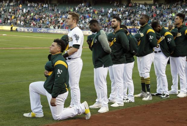 Bruce Maxwell during national anthem playing - 23 Sept 2017