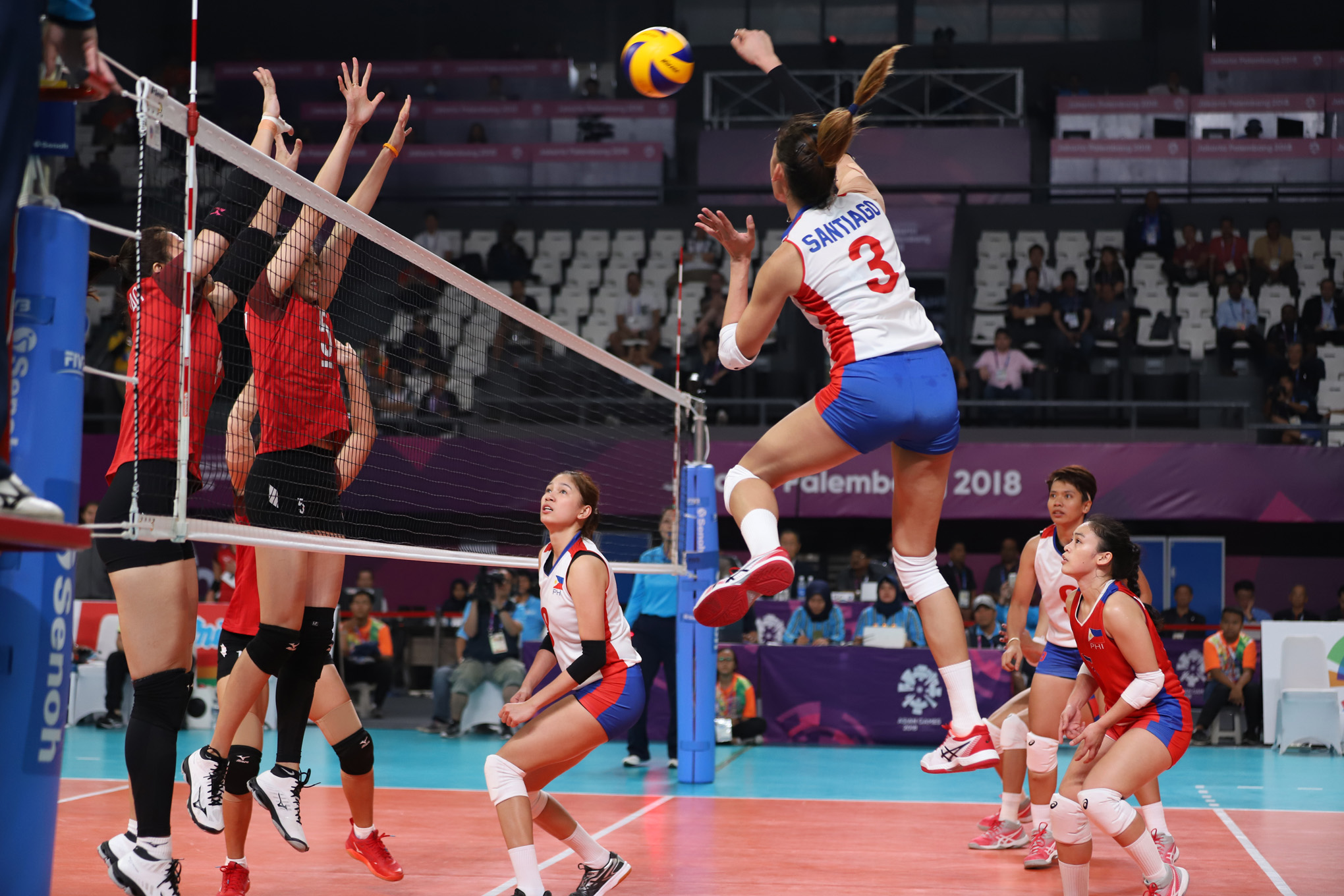 Jaja Santiago of the Philippine women's volleyball team scores a goal against her opponent from Thailand during the first match of the 18th Asian Games in Jakarta Palembang. PHOTO/PSC