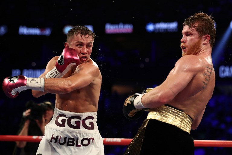 Gennady Golovkin and Canelo Alvarez exchange punches during their WBC/WBA middleweight title fight at T-Mobile Arena on September 15, 2018 in Las Vegas, Nevada.  