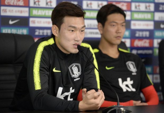 korean South Korea's national football players, defender Kim Young-gwon (R) and defender Jang Hyun-soo (L) attend a press conference at the Spartak Stadium in Saint Petersburg on June 15, 2018, during the Russia 2018 World Cup football tournament. (Photo by OLGA MALTSEVA / AFP)