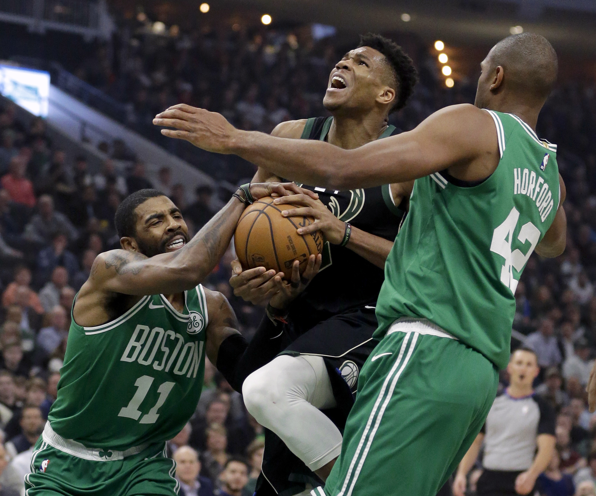 NBA-leading Milwaukee Bucks hold off Boston Celtics 98-97