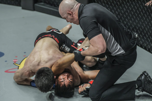 Eduard Folayang locked in an arm triangle choke by Shinya Aoki. photo from ONE Championship