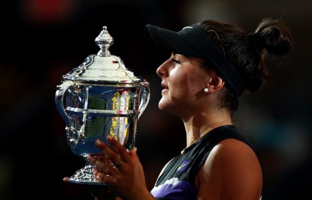 NEW YORK, NEW YORK - SEPTEMBER 07: Bianca Andreescu of Canada holds the championship trophy during the trophy presentation ceremony after winning the Women's Singles final against Serena Williams of the United States on day thirteen of the 2019 US Open at the USTA Billie Jean King National Tennis Center on September 07, 2019 in Queens borough of New York City.   Clive Brunskill/Getty Images/AFP