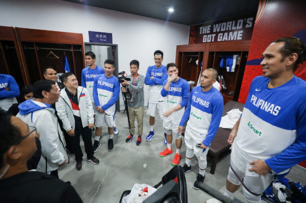 President Rodrigo Roa Duterte and Senator Christopher Lawrence Go share a light moment with the members of Gilas Pilipinas as they visit the locker room before watching the Philippines men's national basketball team go up against Italy during the FIBA Basketball World Cup 2019 game at the Foshan International Sports and Cultural Center in Guangdong on August 31, 2019. SIMEON CELI/ PRESIDENTIAL PHOTO
