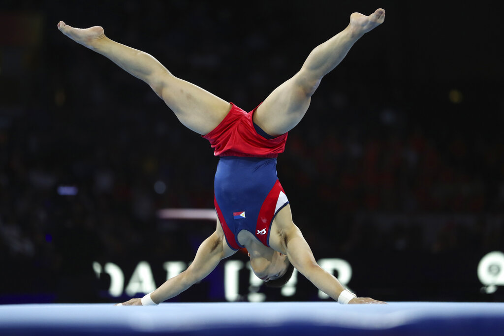 Gold medalist Carlos Edriel Yulo of the Philippines performs in the floor exercise in the men's apparatus finals at the Gymnastics World Championships in Stuttgart, Germany, Saturday, Oct. 12, 2019. 