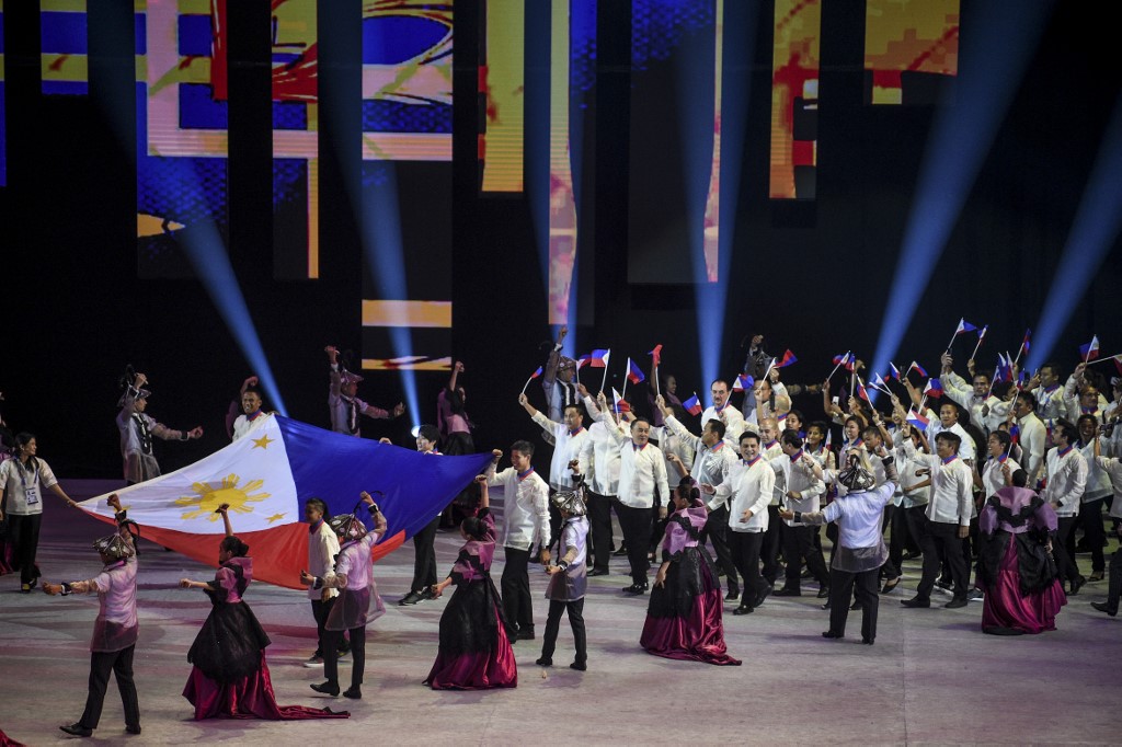 Athletes and officials from the Philippines march during the opening ceremony of the SEA Games (Southeast Asian Games) at the Philippine Arena in Bocaue, Bulacan province, north of Manila on November 30, 2019.