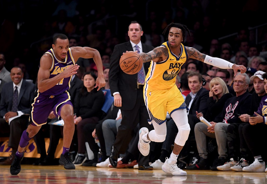 D'Angelo Russell of the Golden State Warriors steals a pass in front of Avery Bradley 