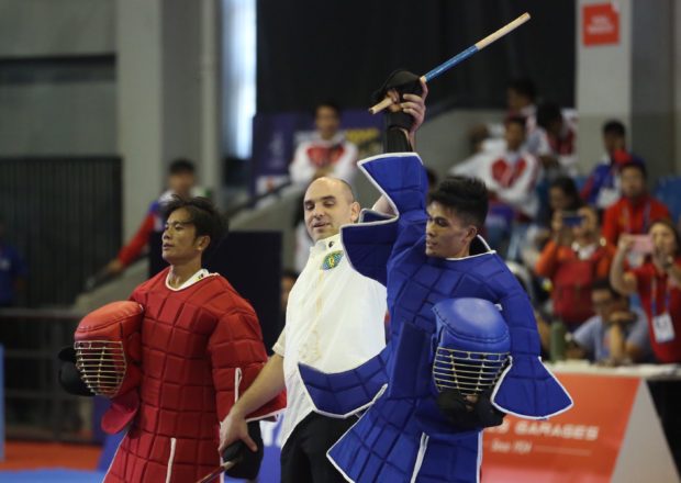 Dexter Bolambao of Philippines wins gold in Arnis full contact live stick competition during the 30th South East Asian Games held in Angeles University Foundation, Angeles, Pampanga, on December 1, 2019.
