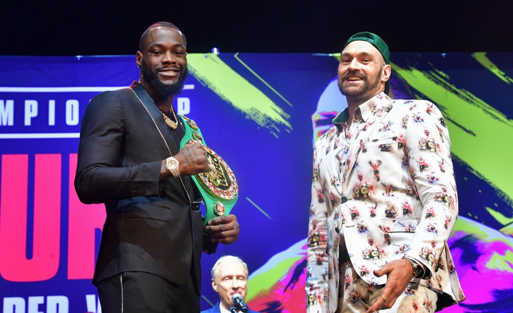 Boxers Deontay Wilder (L) and Tyson Fury