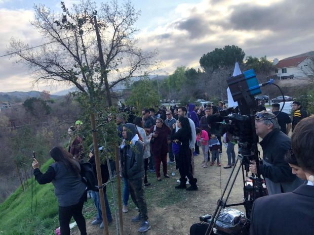 Fans gather near the crash site in Calabasas in California where Kobe Bryant and his daughter were killed in a helicopter crash
