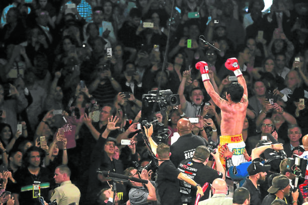 Manny Pacquiao thrives fighting in front of huge crowds—like he did in decisioning Timothy Bradley Jr. in 2016. —REM ZAMORA