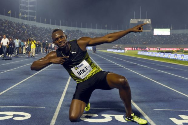 Usain Bolt (C) of Jamaica r