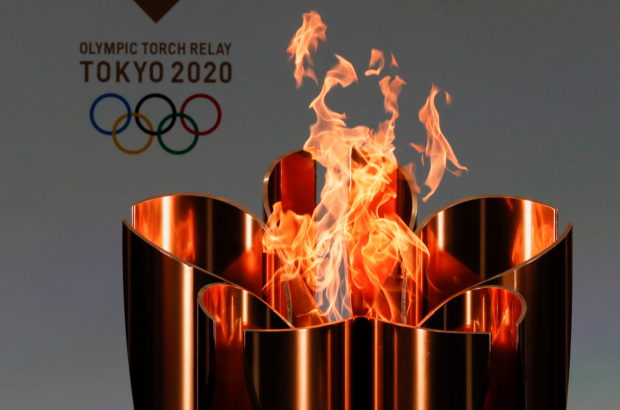 The celebration cauldron is lit on the first day of the Tokyo 2020 Olympic torch relay in Naraha, Fukushima prefecture, Japan March 25, 2021. REUTERS/Kim Kyung-Hoon/Pool