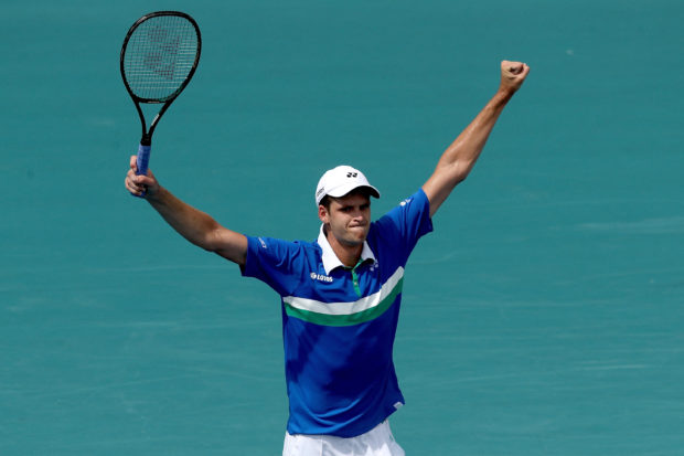 Hubert Hurkacz of Poland celebrate match point against Stefanos Tsitsipas of Greece in the quarterfinals during the Miami Open at Hard Rock Stadium on April 01, 2021 in Miami Gardens, Florida.  