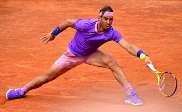 Spain's Rafael Nadal returns the ball to Germany's Alexander Zverev during their tennis match at the Men's Italian Open at Foro Italico on May 14, 2021 in Rome, Italy. (Photo by ANDREAS SOLARO / AFP)