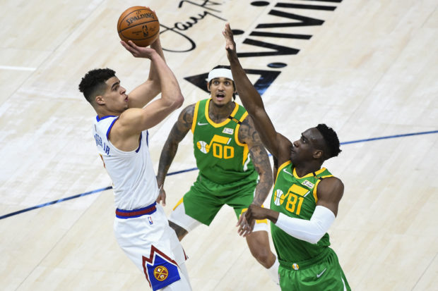 Michael Porter Jr. #1 of the Denver Nuggets shoots against Miye Oni #81 of the Utah Jazz during a game at Vivint Smart Home Arena on May 7, 2021 in Salt Lake City, Utah. NOTE TO USER: User expressly acknowledges and agrees that, by downloading and/or using this photograph, user is consenting to the terms and conditions of the Getty Images License Agreement.   Alex Goodlett/Getty Images/AFP (Photo by Alex Goodlett / GETTY IMAGES NORTH AMERICA / Getty Images via AFP)