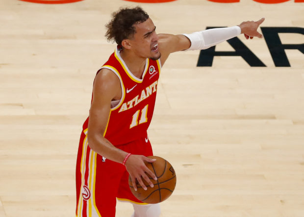Trae Young #11 of the Atlanta Hawks reacts in the second half against the New York Knicks during game three of the Eastern Conference Quarterfinals at State Farm Arena on May 28, 2021 in Atlanta, Georgia. NOTE TO USER: User expressly acknowledges and agrees that, by downloading and/or using this photograph, user is consenting to the terms and conditions of the Getty Images License Agreement.   Todd Kirkland/Getty Images/AFP (Photo by Todd Kirkland / GETTY IMAGES NORTH AMERICA / Getty Images via AFP)