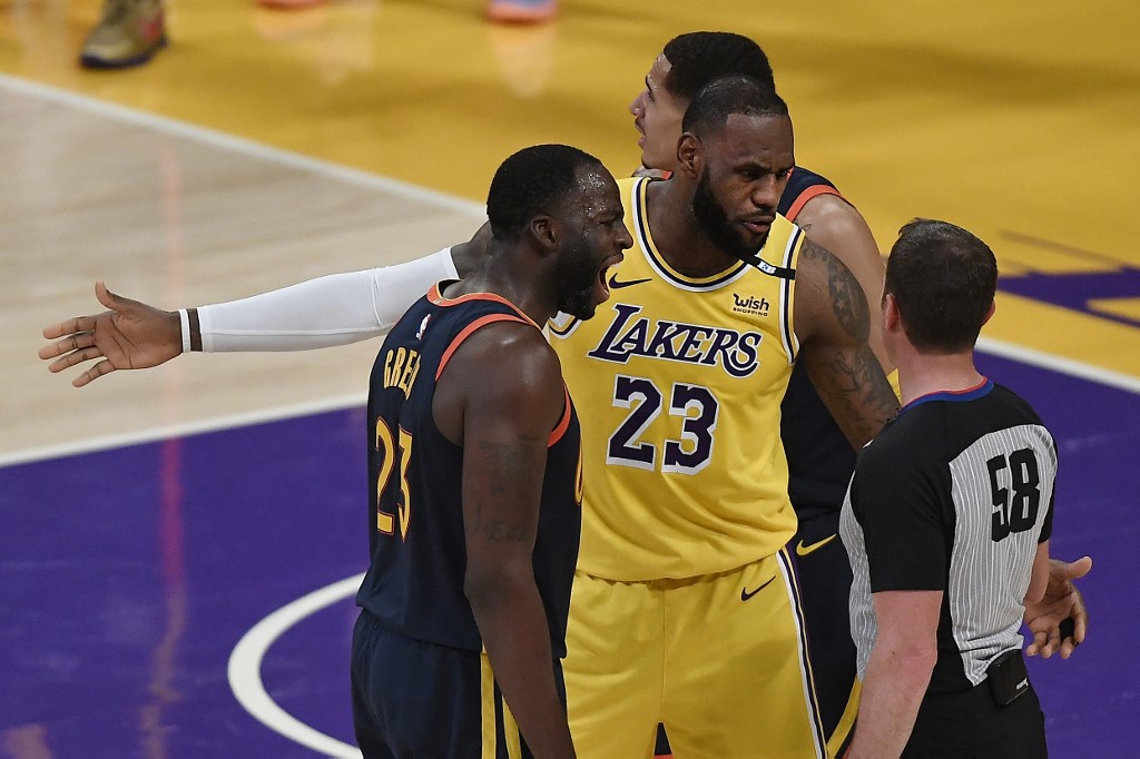 Draymond Green #23 of the Golden State Warriors and LeBron James #23 of the Los Angeles Lakers