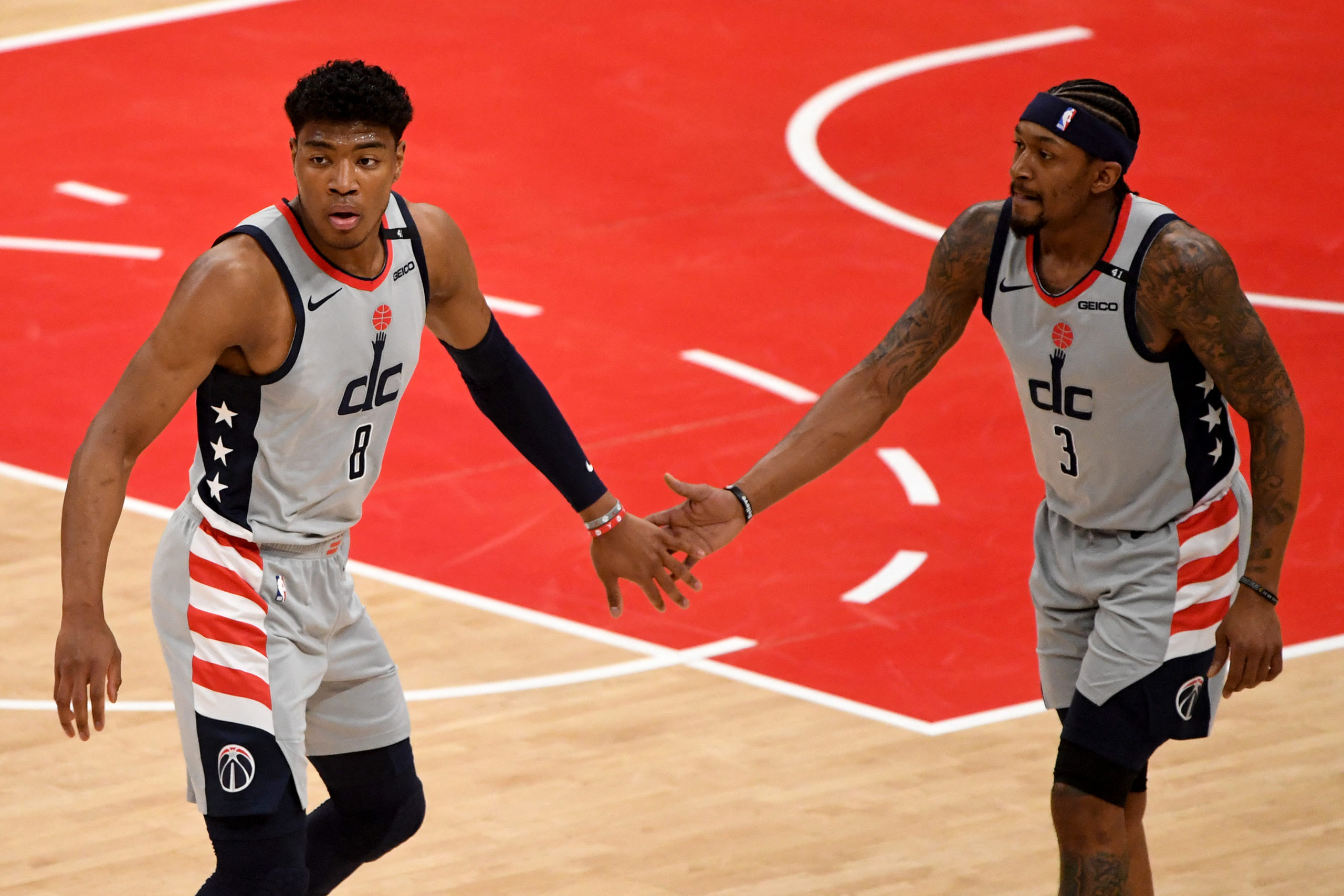Rui Hachimura #8 and Bradley Beal #3 of the Washington Wizards celebrate after a play against the Indiana Pacers during the first half at Capital One Arena on May 20, 2021 in Washington, DC. NOTE TO USER: User expressly acknowledges and agrees that, by downloading and or using this photograph, User is consenting to the terms and conditions of the Getty Images License Agreement. Will Newton/Getty Images/AFP (Photo by Will Newton / GETTY IMAGES NORTH AMERICA / Getty Images via AFP)