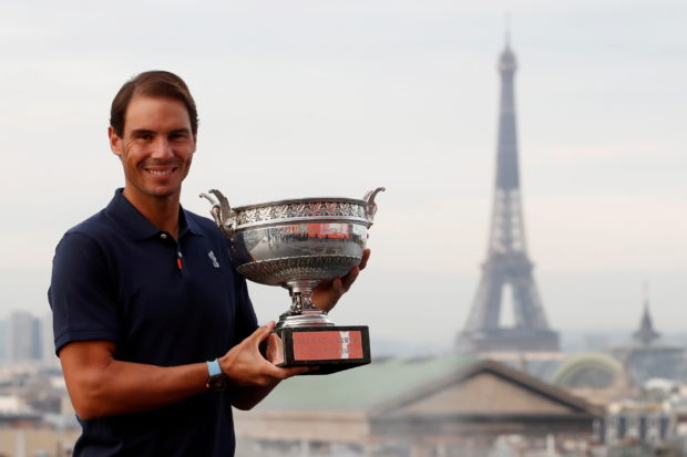 Tennis - French Open - Galeries Lafayette Rooftop, Paris, France - October 12, 2020  Spain's Rafael Nadal poses with the trophy after winning the French Open yesterday  REUTERS/Gonzalo Fuentes/File Photo