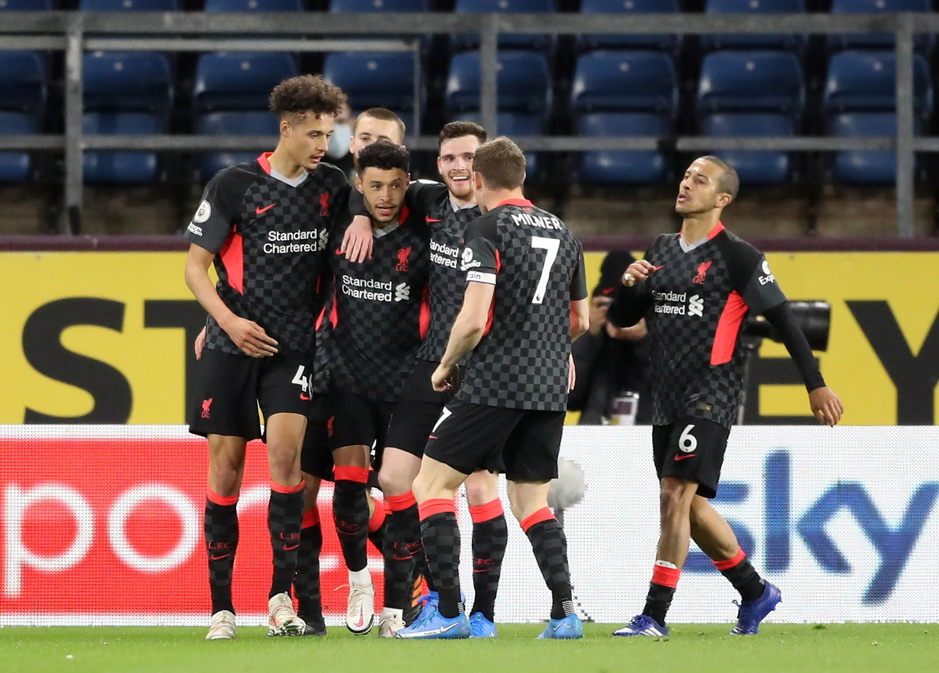 Liverpool's Alex Oxlade-Chamberlain celebrates scoring their third goal with teammates