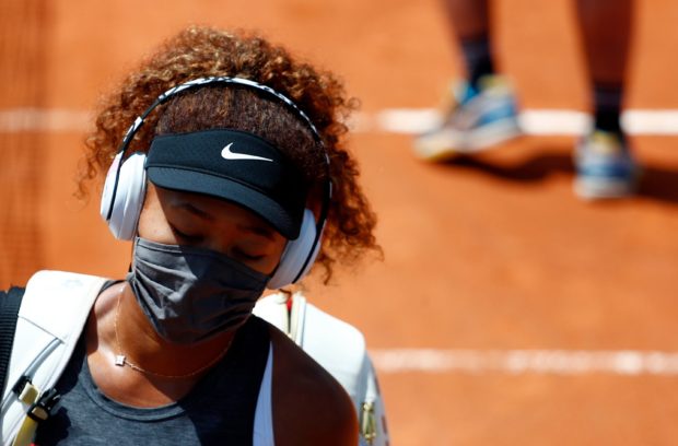 Tennis -WTA Premier 5 - Italian Open - Foro Italico, Rome, Italy - May 12, 2021 Japan’s Naomi Osaka looks dejected after losing her second round match against Jessica Pegula of U.S. REUTERS/Guglielmo Mangiapane/File Photo
