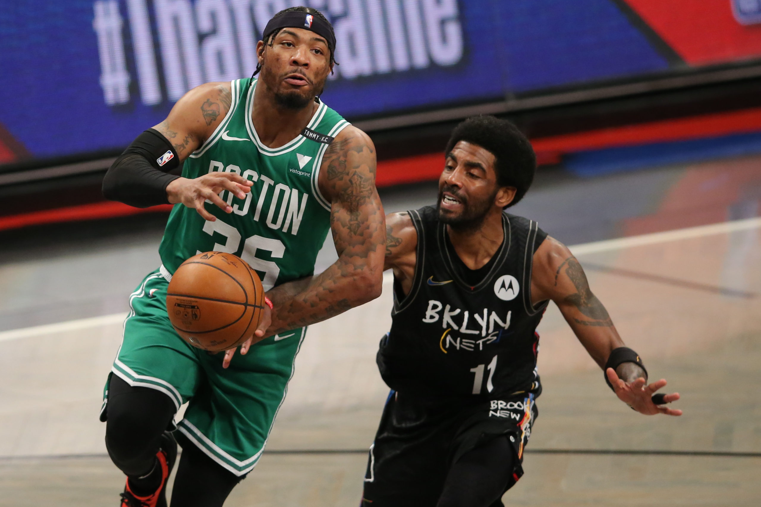 Brooklyn Nets point guard Kyrie Irving (11) strips the ball from Boston Celtics point guard Marcus Smart