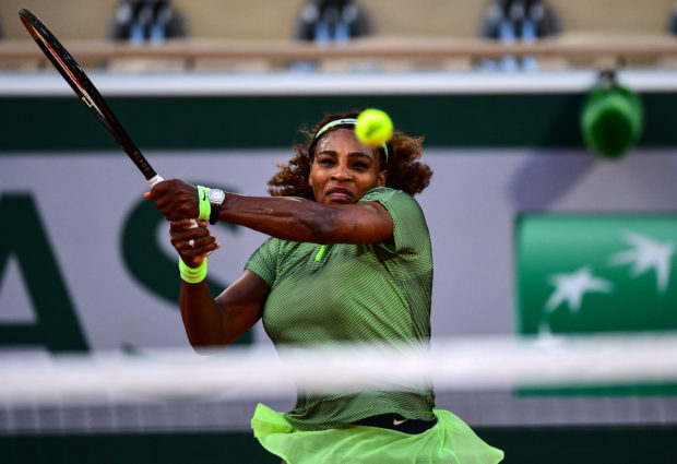Serena Williams of the US returns the ball to Romania's Mihaela Buzarnescu during their women's singles second round tennis match on Day 4 of The Roland Garros 2021 French Open tennis tournament in Paris on June 2, 2021. (Photo by Martin BUREAU / AFP)