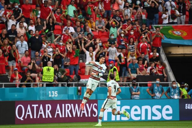 Portugal's forward Cristiano Ronaldo celebrates scoring his team's third goal during the UEFA EURO 2020