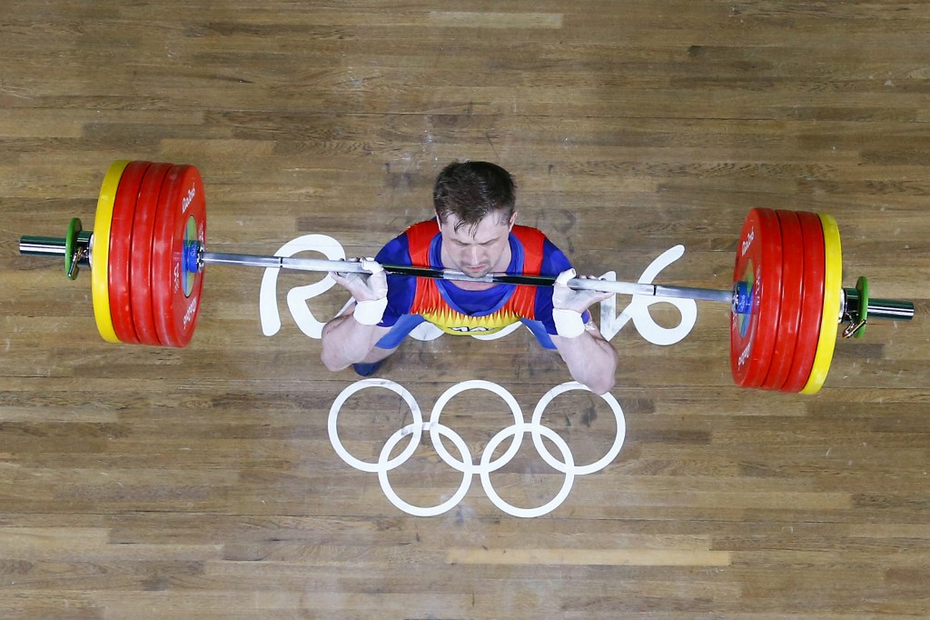 Romania's Gabriel Sincraian weightlifting
