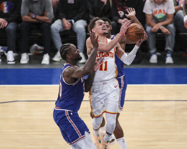 Trae Young #11 of the Atlanta Hawks drives past Julius Randle #30 of the New York Knicks in the fourth quarter of Game Five of the Eastern Conference first round series at Madison Square Garden on June 02, 2021 in New York City. NOTE TO USER: User expressly acknowledges and agrees that, by downloading and or using this photograph, User is consenting to the terms and conditions of the Getty Images License Agreement.   Wendell Cruz-Pool/Getty Images/AFP (Photo by POOL / GETTY IMAGES NORTH AMERICA / Getty Images via AFP)