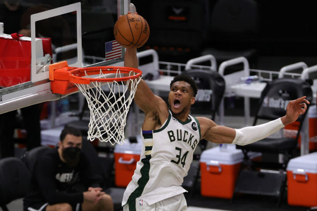 Giannis Antetokounmpo #34 of the Milwaukee Bucks dunks against the Brooklyn Nets during the second half of Game Four of the Eastern Conference second round playoff series at the Fiserv Forum on June 13, 2021 in Milwaukee, Wisconsin. NOTE TO USER: User expressly acknowledges and agrees that, by downloading and or using this photograph, User is consenting to the terms and conditions of the Getty Images License Agreement. Stacy Revere/Getty Images/AFP (Photo by Stacy Revere / GETTY IMAGES NORTH AMERICA / Getty Images via AFP)