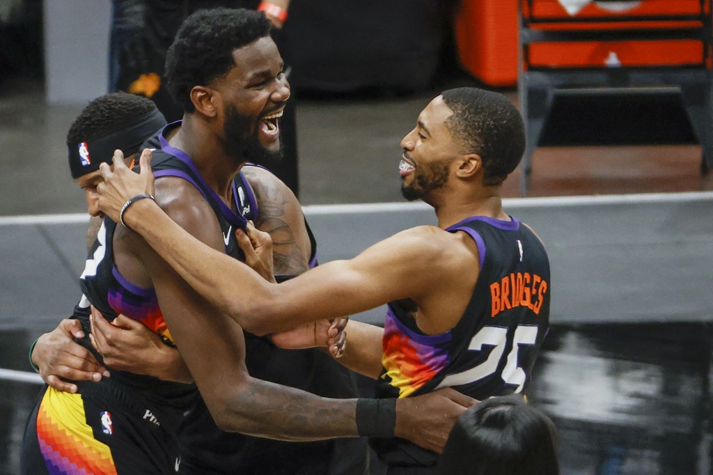 Deandre Ayton #22 of the Phoenix Suns and Mikal Bridges #25 celebrate defeating the LA Clippers 104-103 in game two of the NBA Western Conference finals