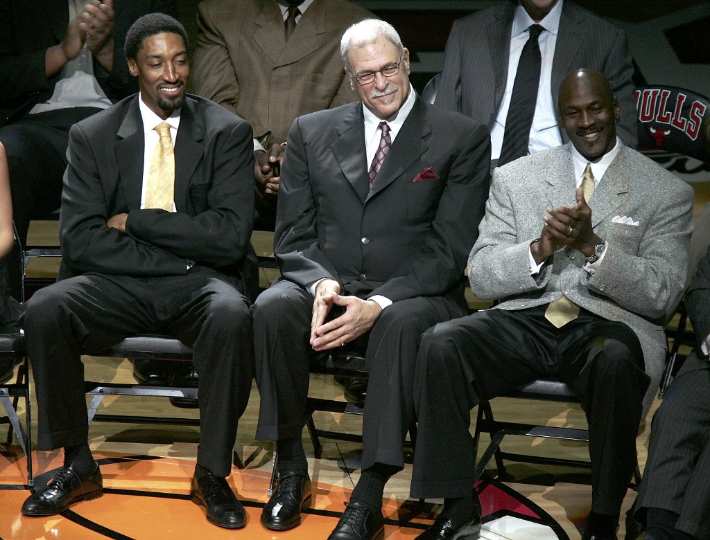 Scottie Pippen, Phil Jackson and Michael Jordan, formerly of the Chicago Bulls, look on during a ceremony retiring Pippen's #33 at halftime of a game between the Bulls and the Los Angeles Lakers on December 9, 2005 at the United Center in Chicago, Illinois. 