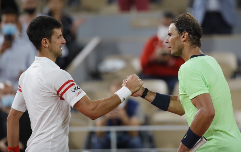 Serbia's Novak Djokovic shakes hands with Spain's Rafael Nadal