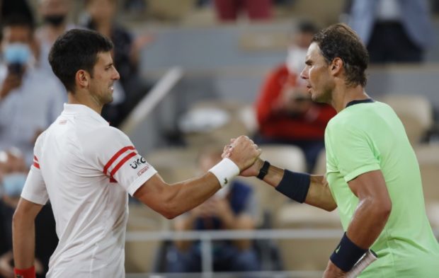 Serbia's Novak Djokovic shakes hands with Spain's Rafael Nadal after winning their semi final match REUTERS/Sarah Meyssonnier
