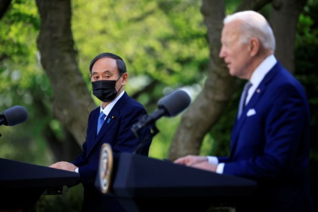 Japan's Prime Minister Yoshihide Suga and U.S. President Joe Biden hold a joint news conference in the Rose Garden at the White House in Washington, U.S., April 16, 2021. REUTERS/Tom Brenner