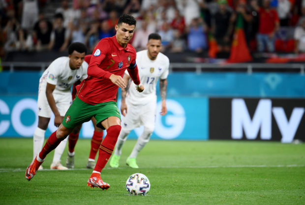 Soccer Football - Euro 2020 - Group F - Portugal v France - Puskas Arena, Budapest, Hungary - June 23, 2021 Portugal's Cristiano Ronaldo scores their second goal from the penalty spot Pool via REUTERS/Franck Fife