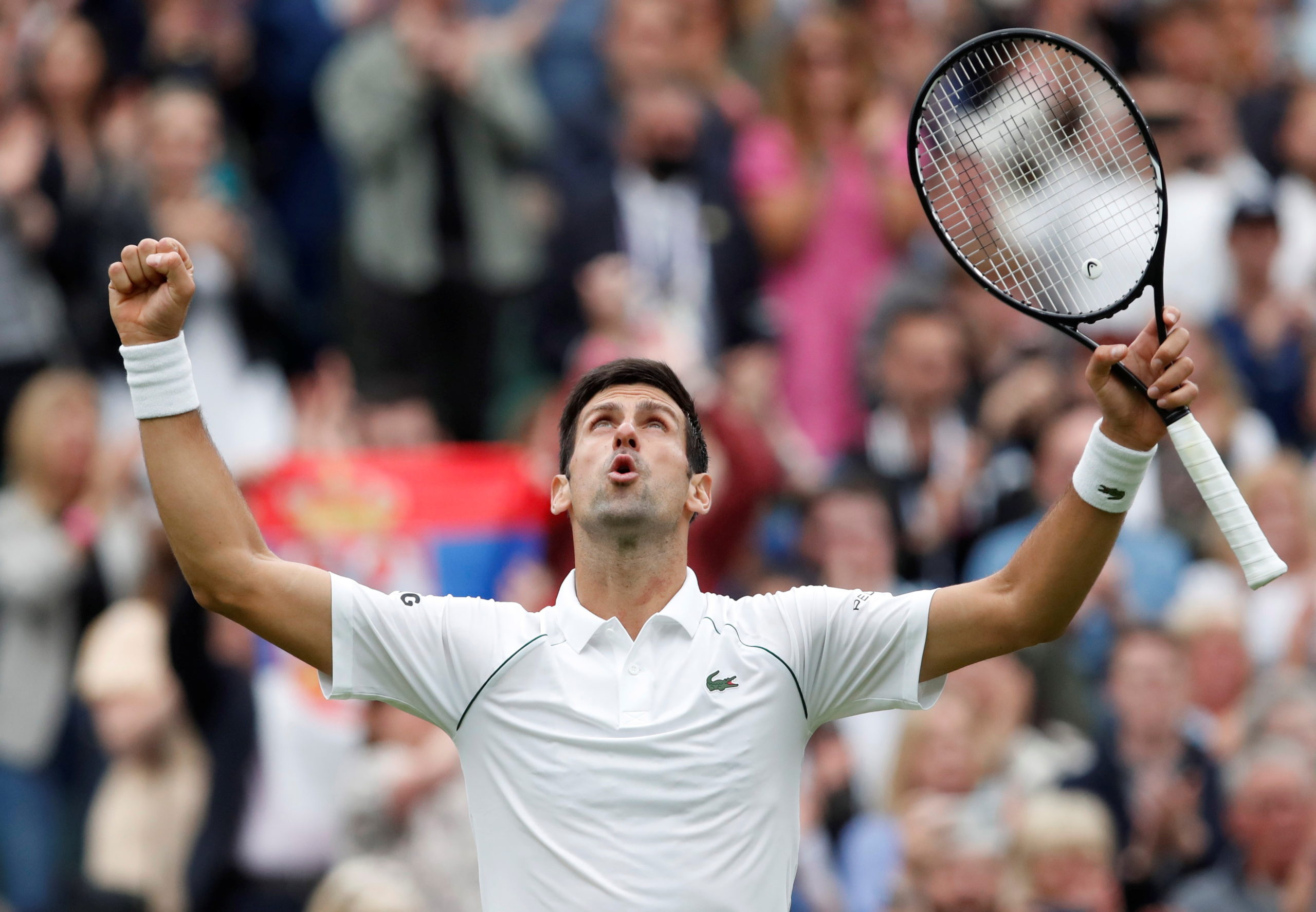 Serbia's Novak Djokovic celebrates winning his first round match against Britain's Jack Draper 