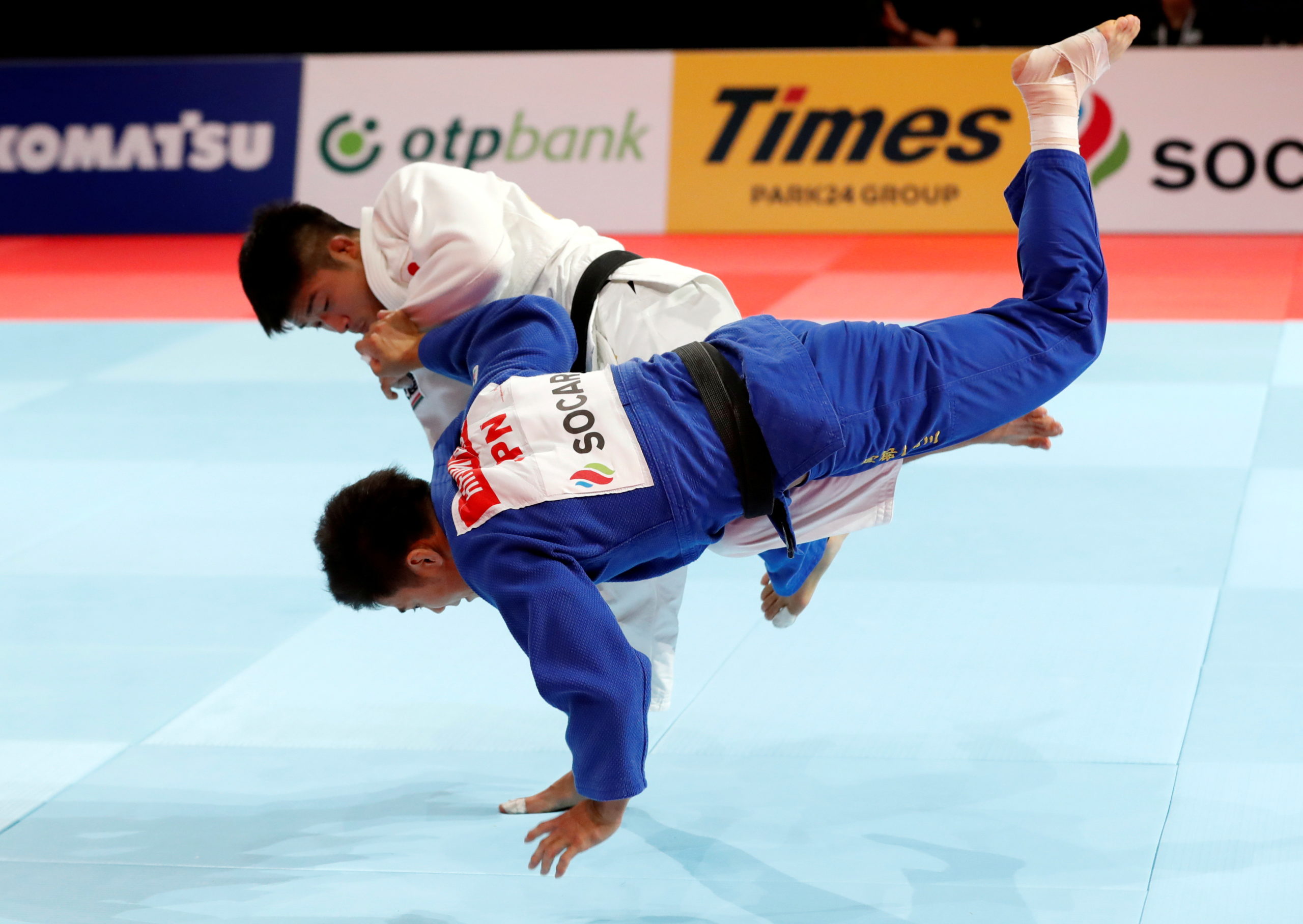 Japan's Joshiro Maruyama and Japan's Hifumi Abe compete 