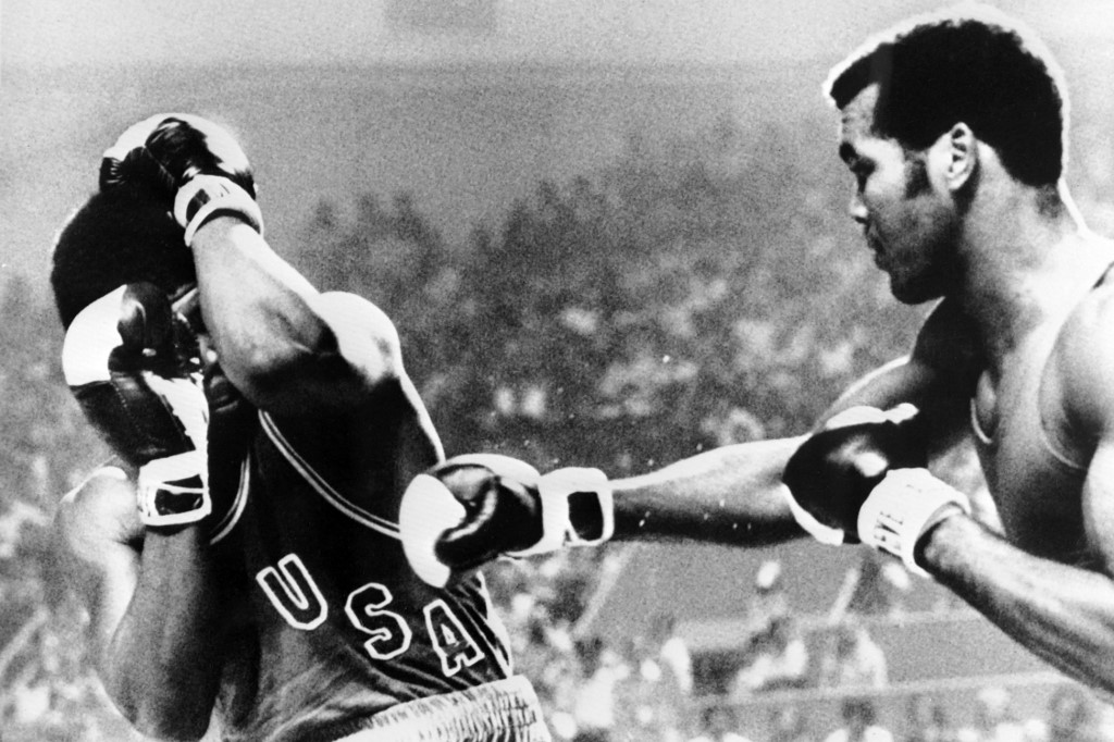 Cuban Teofilo Stevenson (R) and US John Tate (L) fight during their Heavyweight semifinal boxing match on July 29, 1976 of the Summer Olympics games in Montreal. 