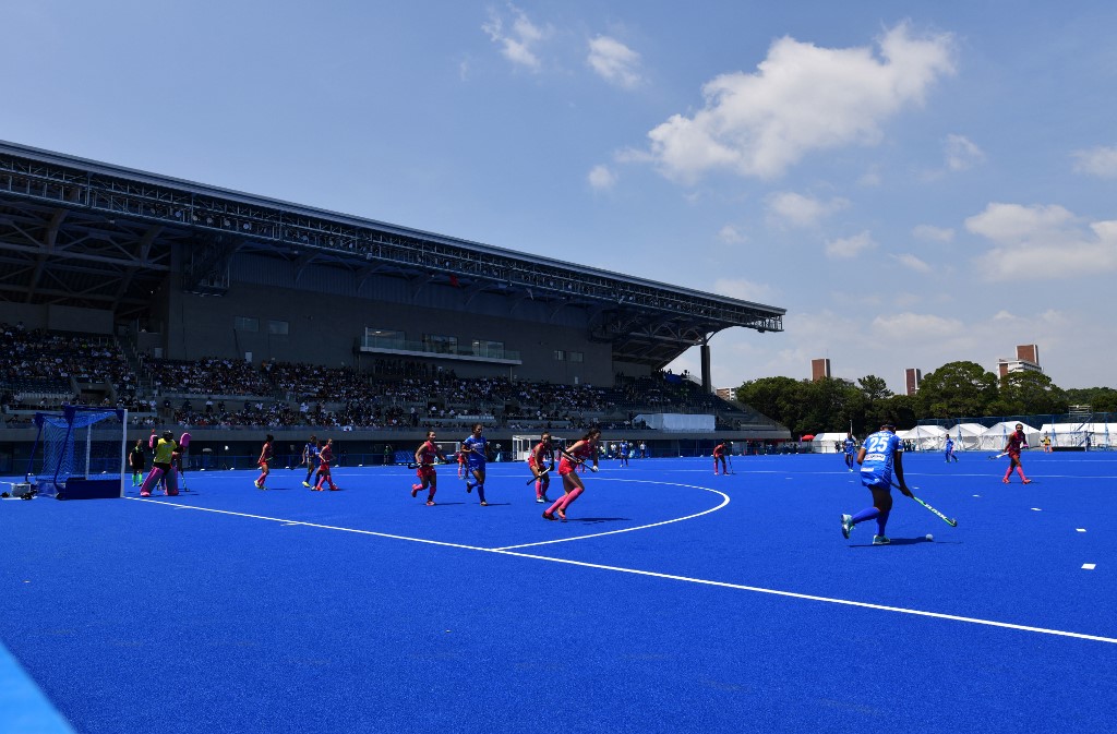 Players of India (blue) and Japan (pink) compete during a women's pool A qualification match between India and Japan at the Ready Steady Tokyo hockey tournament, a test event ahead of the Tokyo 2020 Olympic Games, at the Oi hockey stadium north pitch in Tokyo on August 17, 2019. 