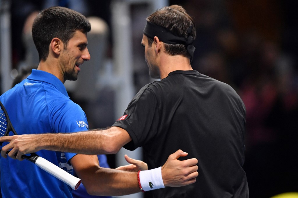 Switzerland's Roger Federer (R) is congratulated by Serbia's Novak Djokovic