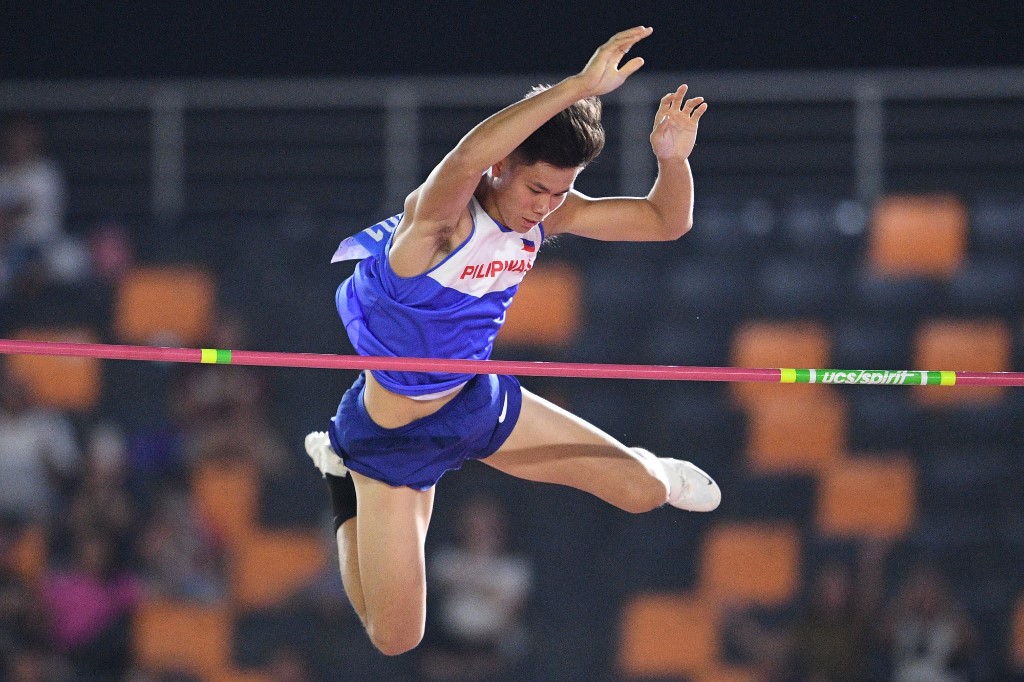 Ernest John Obiena from the Philippines clears the bar in the men's pole vault athletics event at the SEA Games (Southeast Asian Games) in the athletics stadium in Clark City, Capas, Tarlac province north of Manila on December 7, 2019.